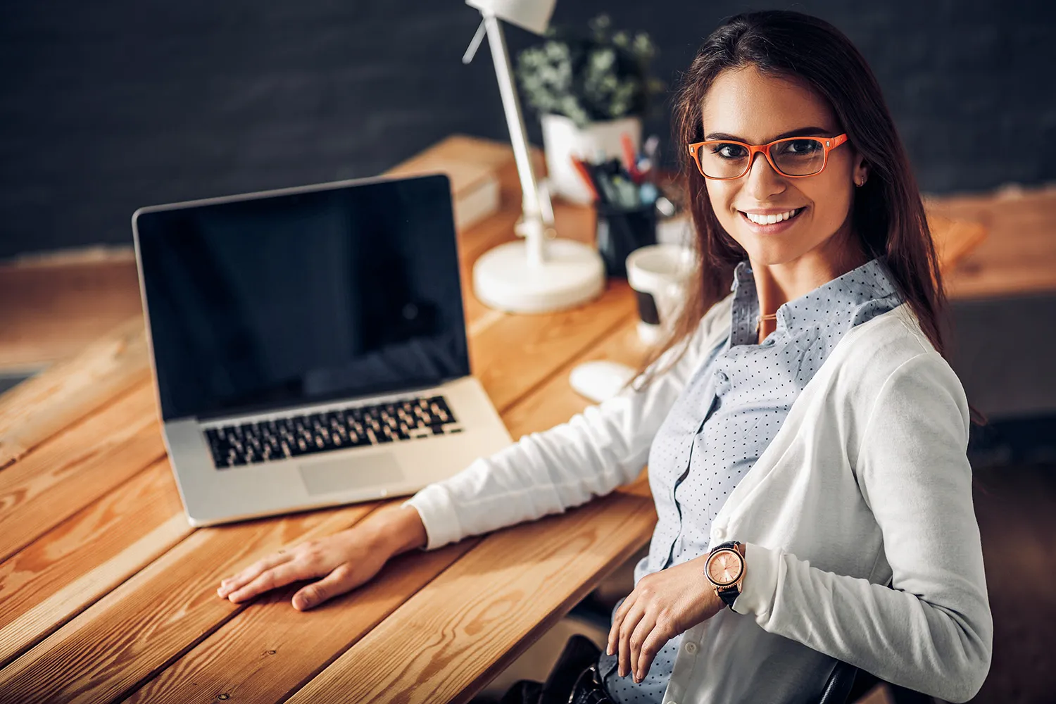 Young female working sitting at a desk